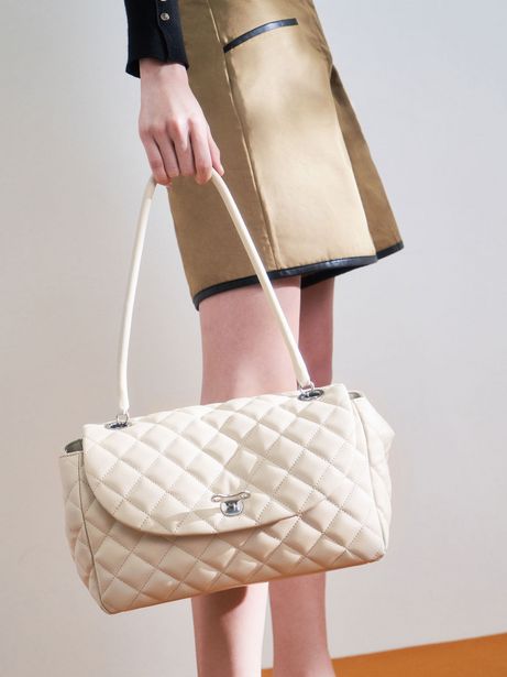 Chain Link Quilted Top Handle Bag offers at S$ 63 in Charles & Keith