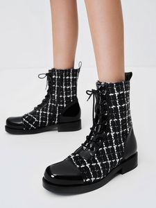 Tweed & Patent Combat Boots offers at S$ 1550 in Charles & Keith