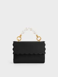 Rowan Bead-Handle Wallet offers at S$ 845 in Charles & Keith