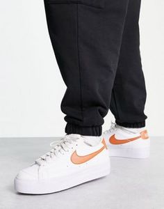 Nike Blazer Low Platform trainers in white and metallic copper offers at S$ 54 in asos